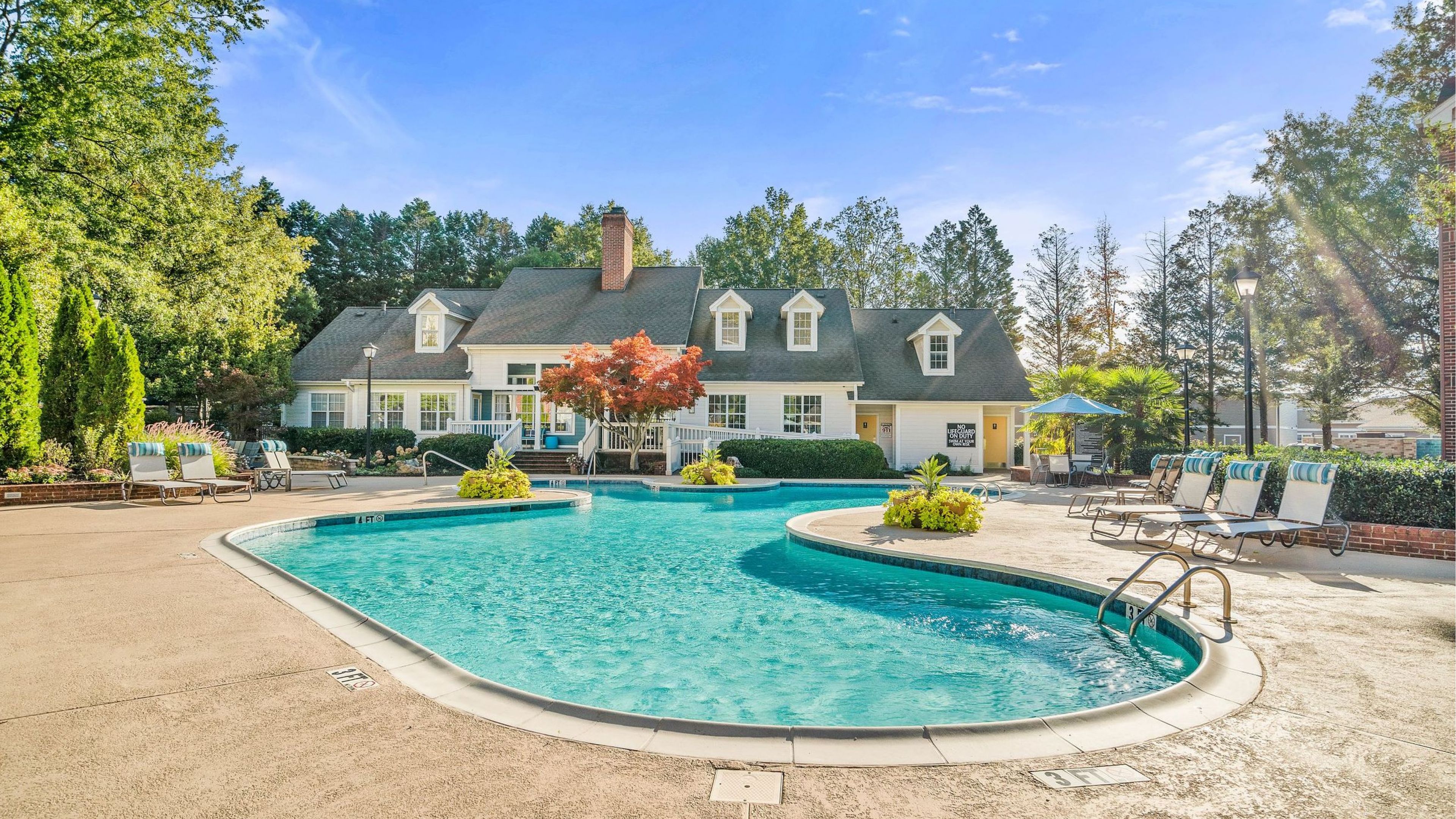 Hawthorne at the Park resident pool amenity with lounge chairs.